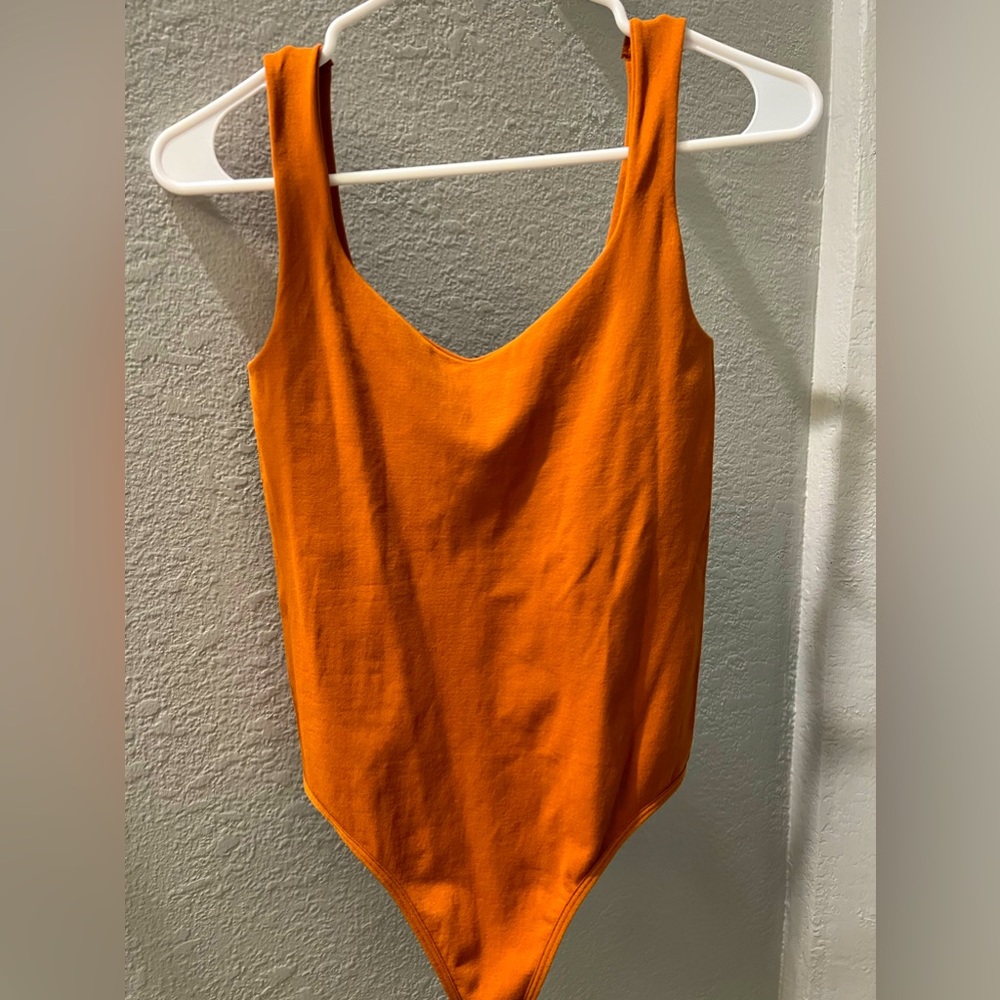 NWOT Free People tank bodysuit rust orange size XS/S